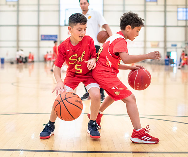 Young Sol players learning ball handling
